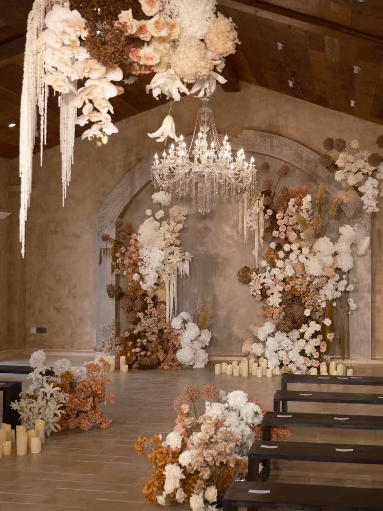 warm ivory wedding ceremony with artificial floral stage